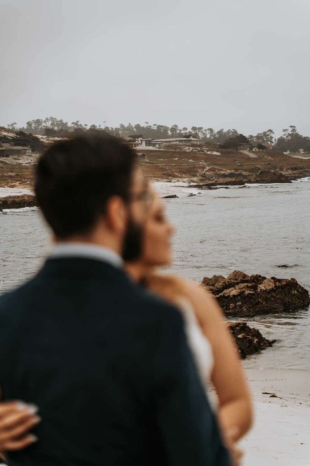 cute couple looking out into the ocean
