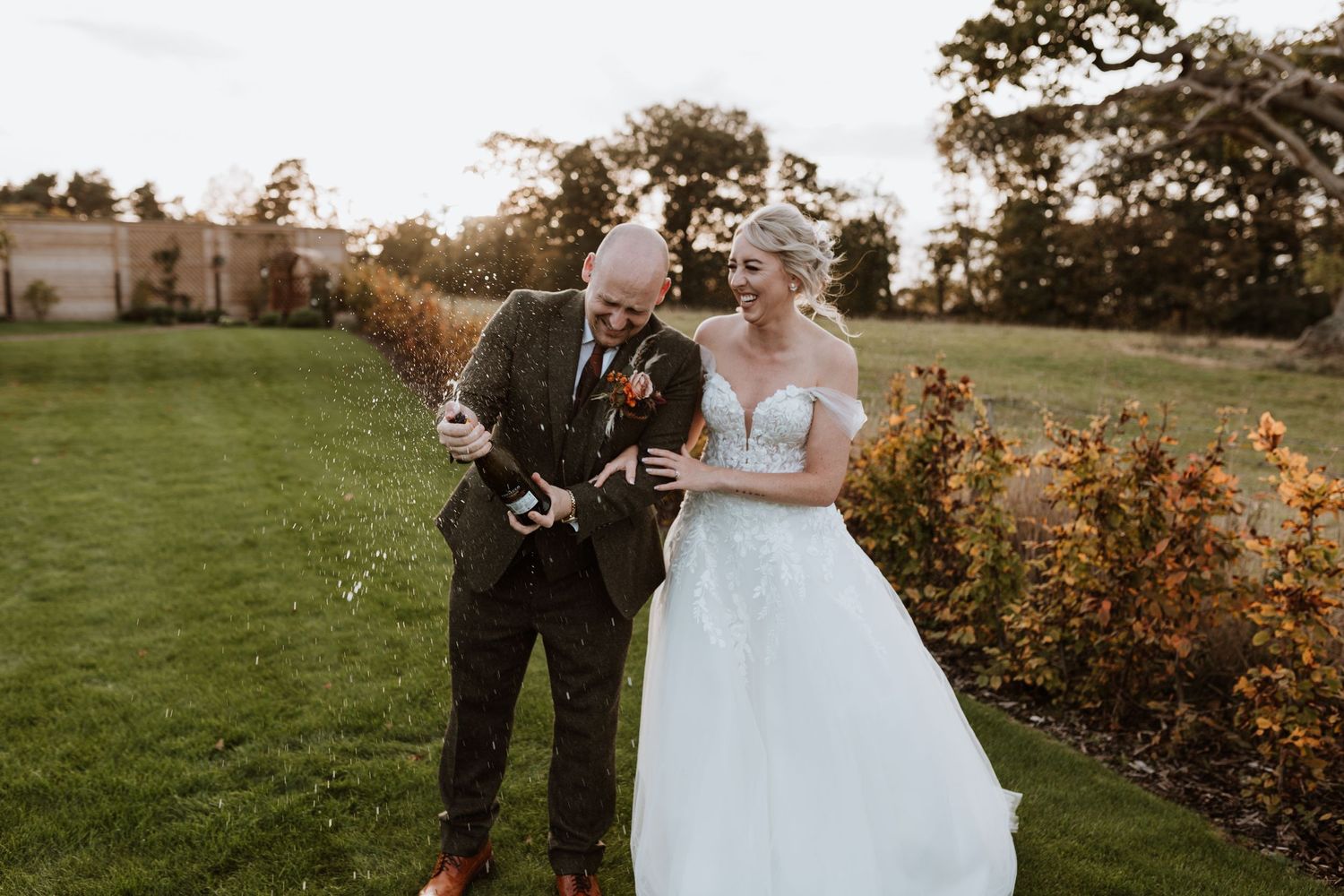 Champagne fizz shot of couple at Malt House Barns, fun alternative wedding photography