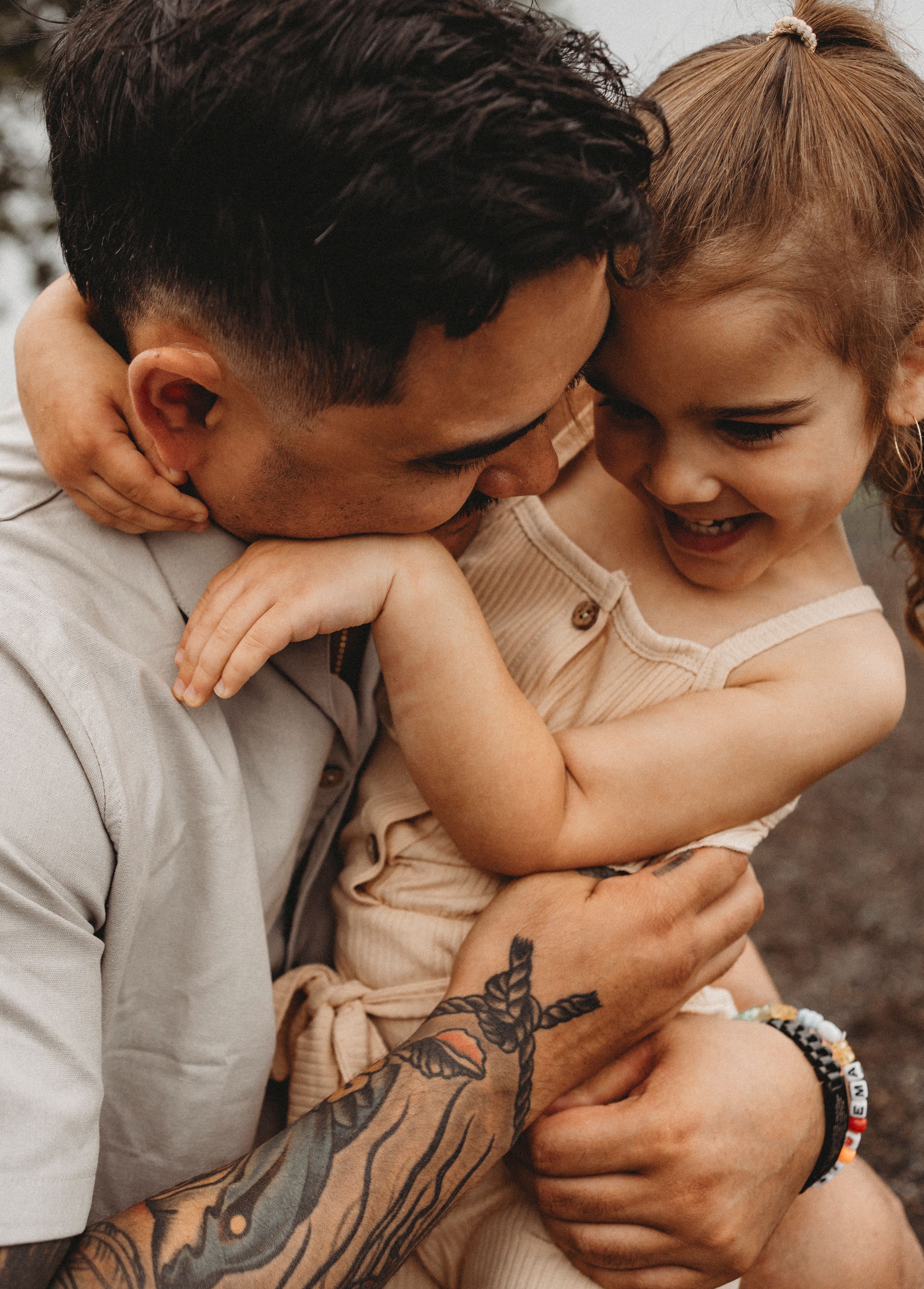 Tender moment captured between parent and child sharing a laugh.