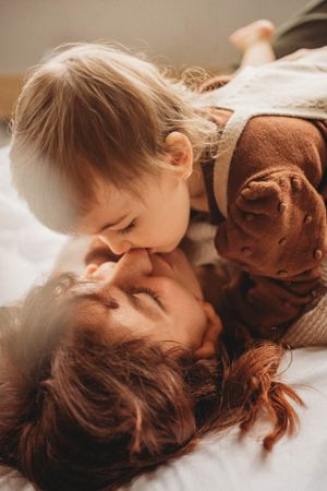 Warm intimate family moment captured in soft natural lighting.