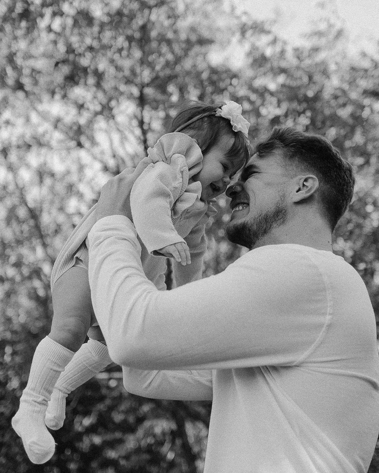Black and white portraits showing tender moments in a garden setting.
