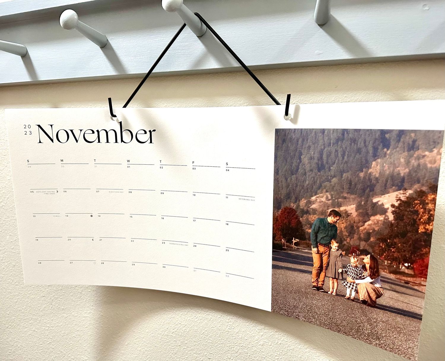 Wall calendar showing November month with vintage family photo attached.