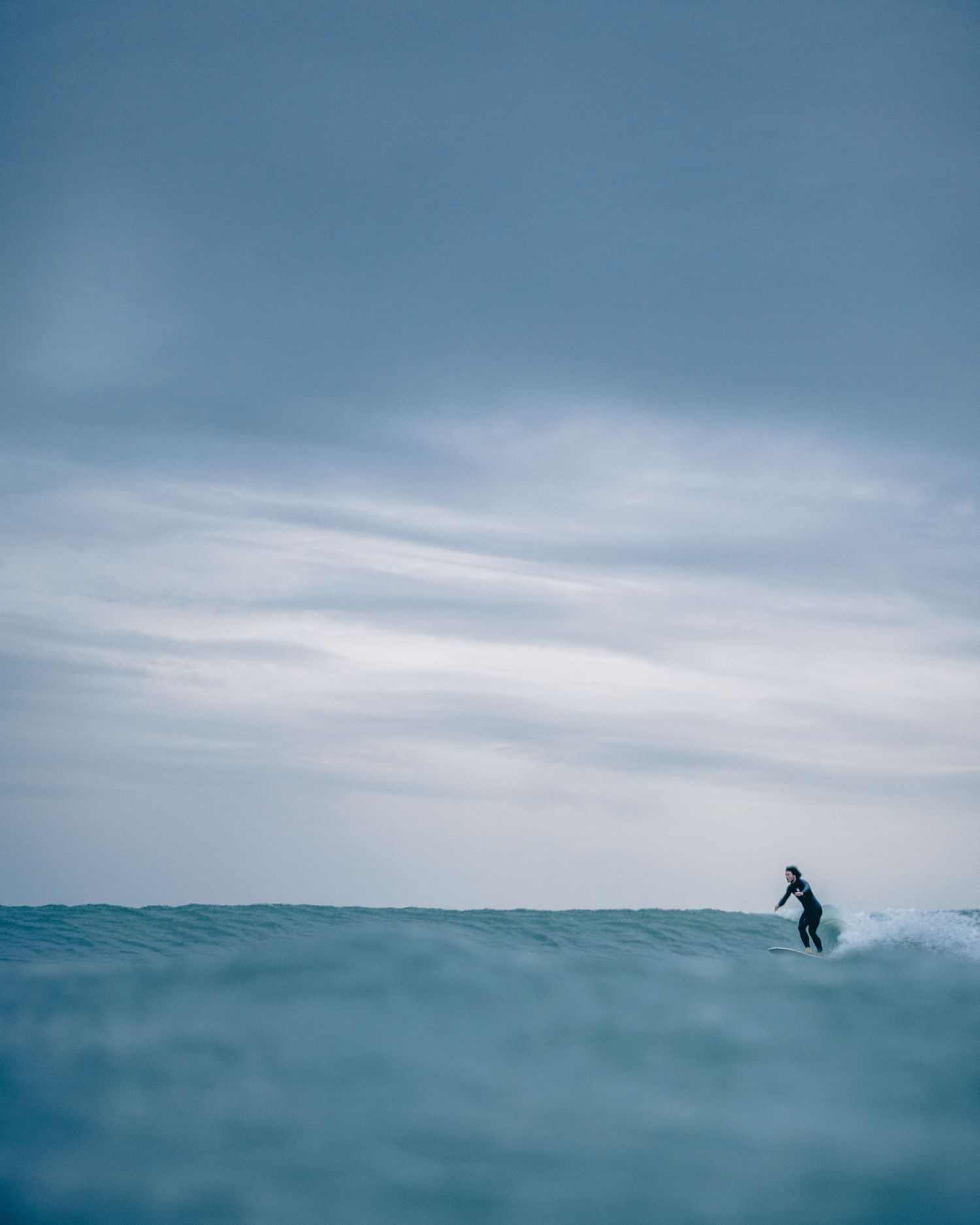 Lost distance shot of a surfer
