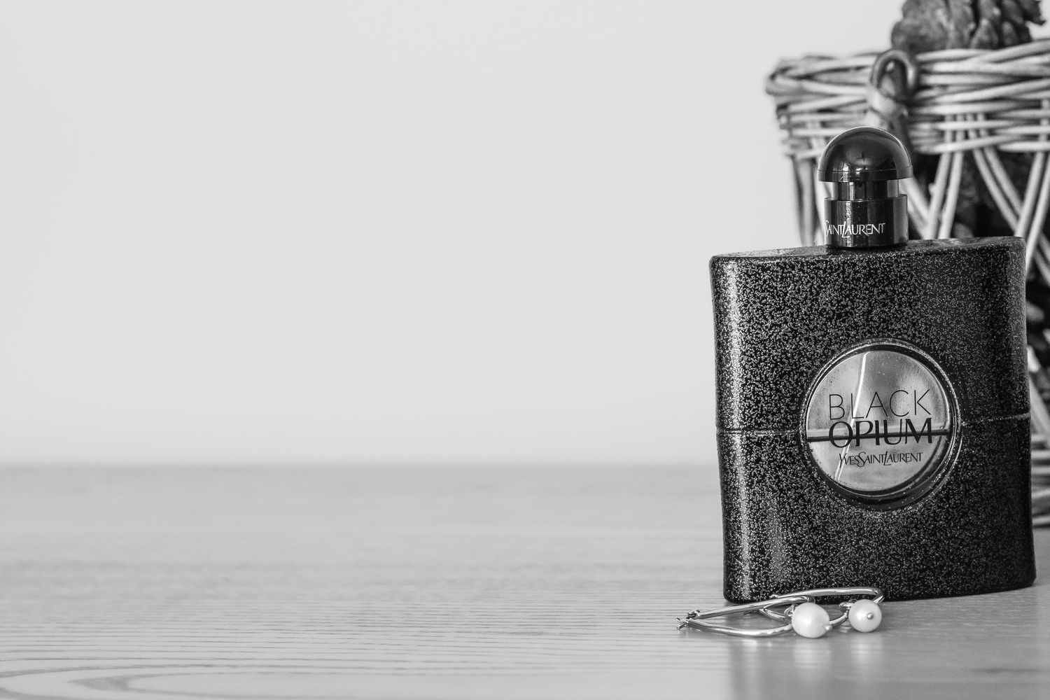 Collection of vintage black and white film cameras arranged on a wooden surface.