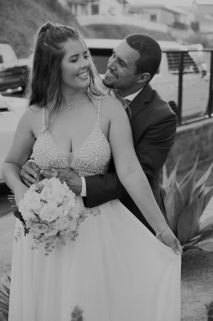 Black and white candid wedding portraits capturing intimate moments between newlyweds.