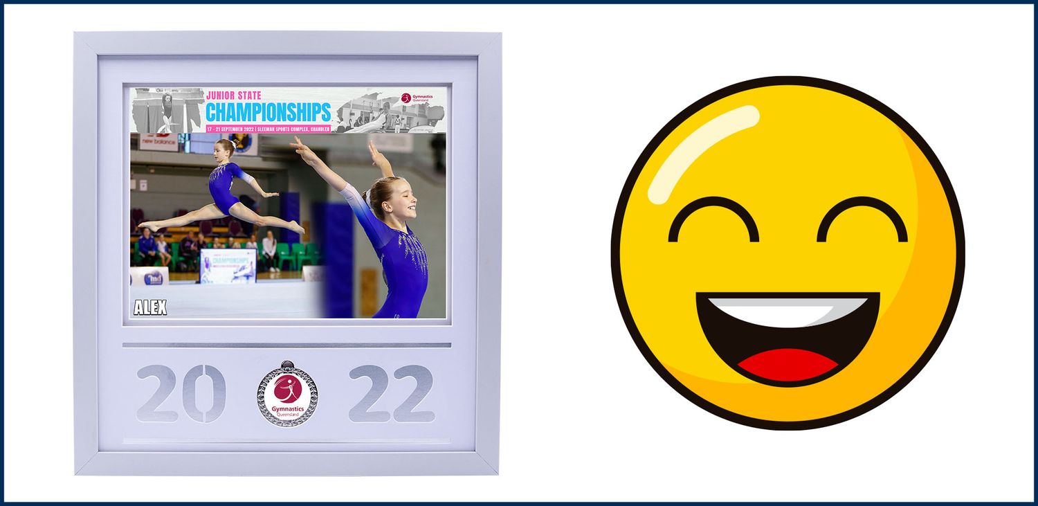 Two framed swimming competition photos with 2022 dates alongside a yellow smiley face emoji.