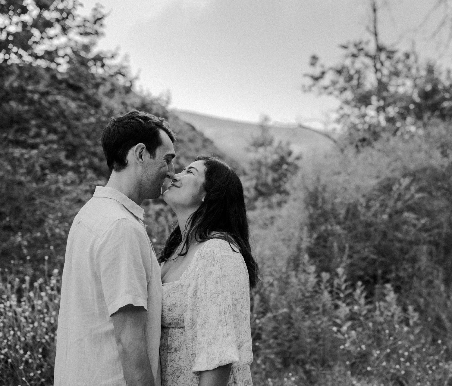 E. Noelle Photography couple engagement in the Los Angeles Malibu hills touching noses together with soft smiles