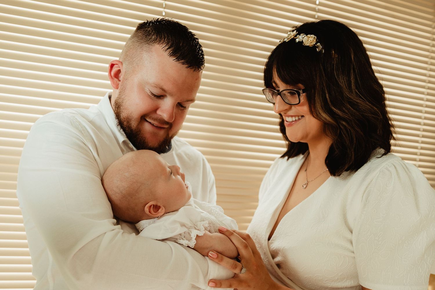 Parents and son at christening