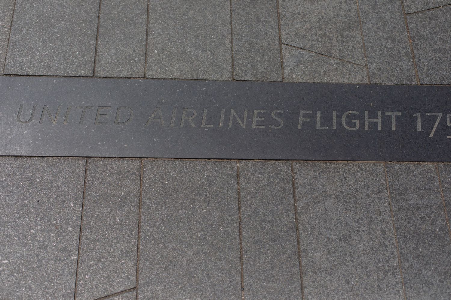 Memorial inscription for United Airlines Flight 175 etched in granite.