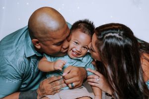 An intimate family moment captured during a Christmas photo session with joyful expressions.