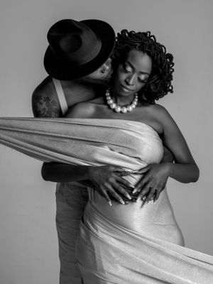 Black and white photo series showing intimate couple dance movements with flowing fabric.