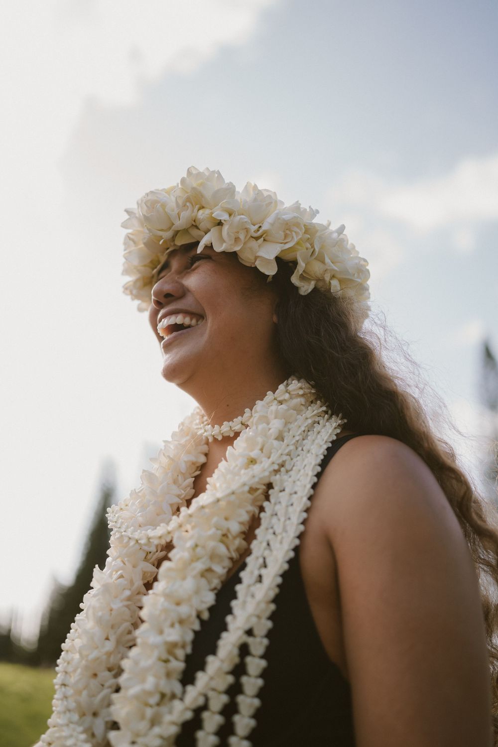 Hawaiian woman smiling with Lei