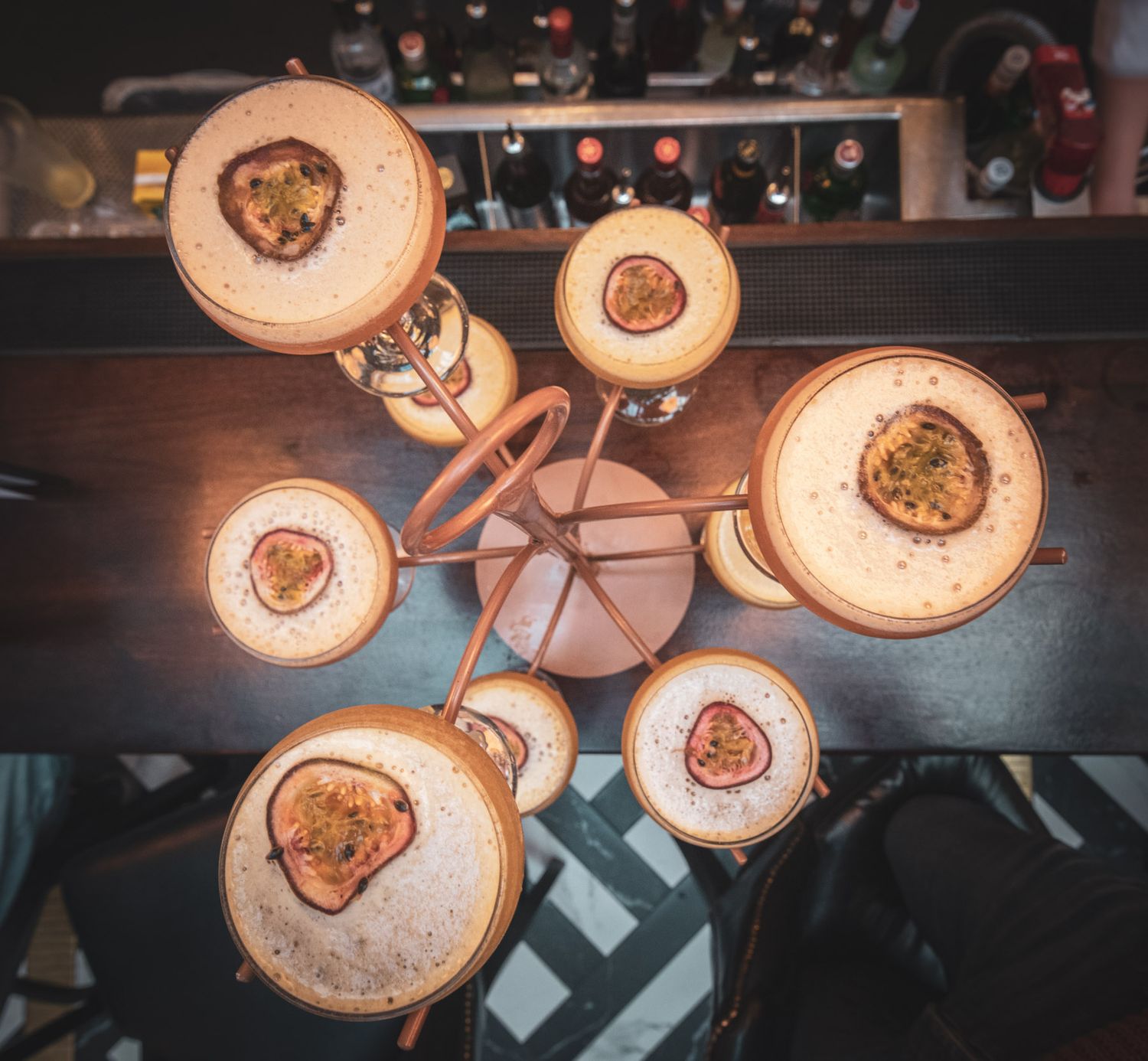 Rustic wooden light fixtures creating warm ambient lighting in a restaurant setting.