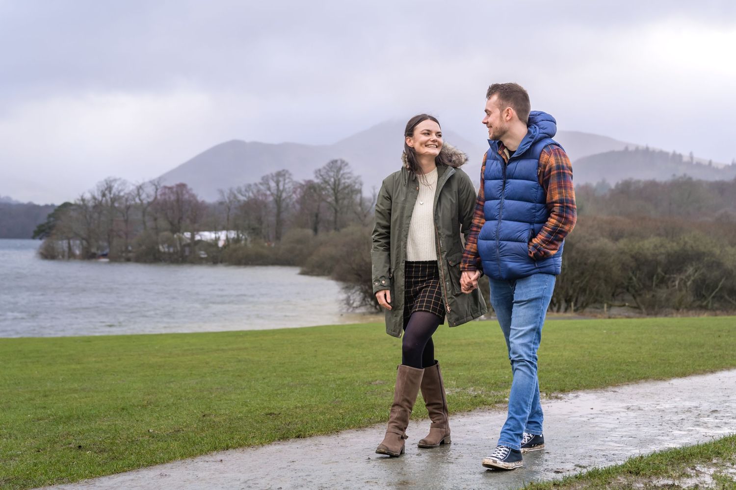 Engaged couple in Crow Park overlooking Derwentwater in the Lake District