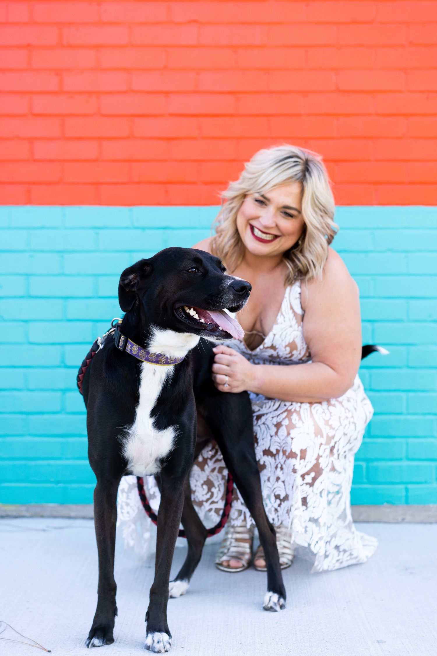 A woman poses with her black lab in Baton Rouge.