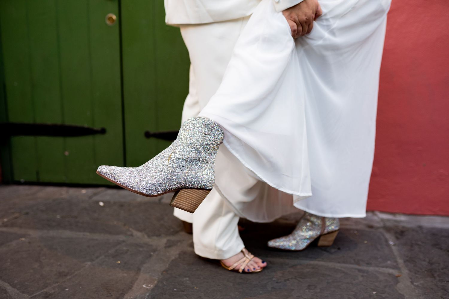 A bride shows off her sparkly sequin booties.