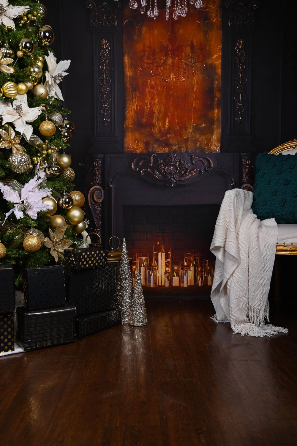 Cozy Christmas corner with decorated tree, fireplace, and white throw blanket.