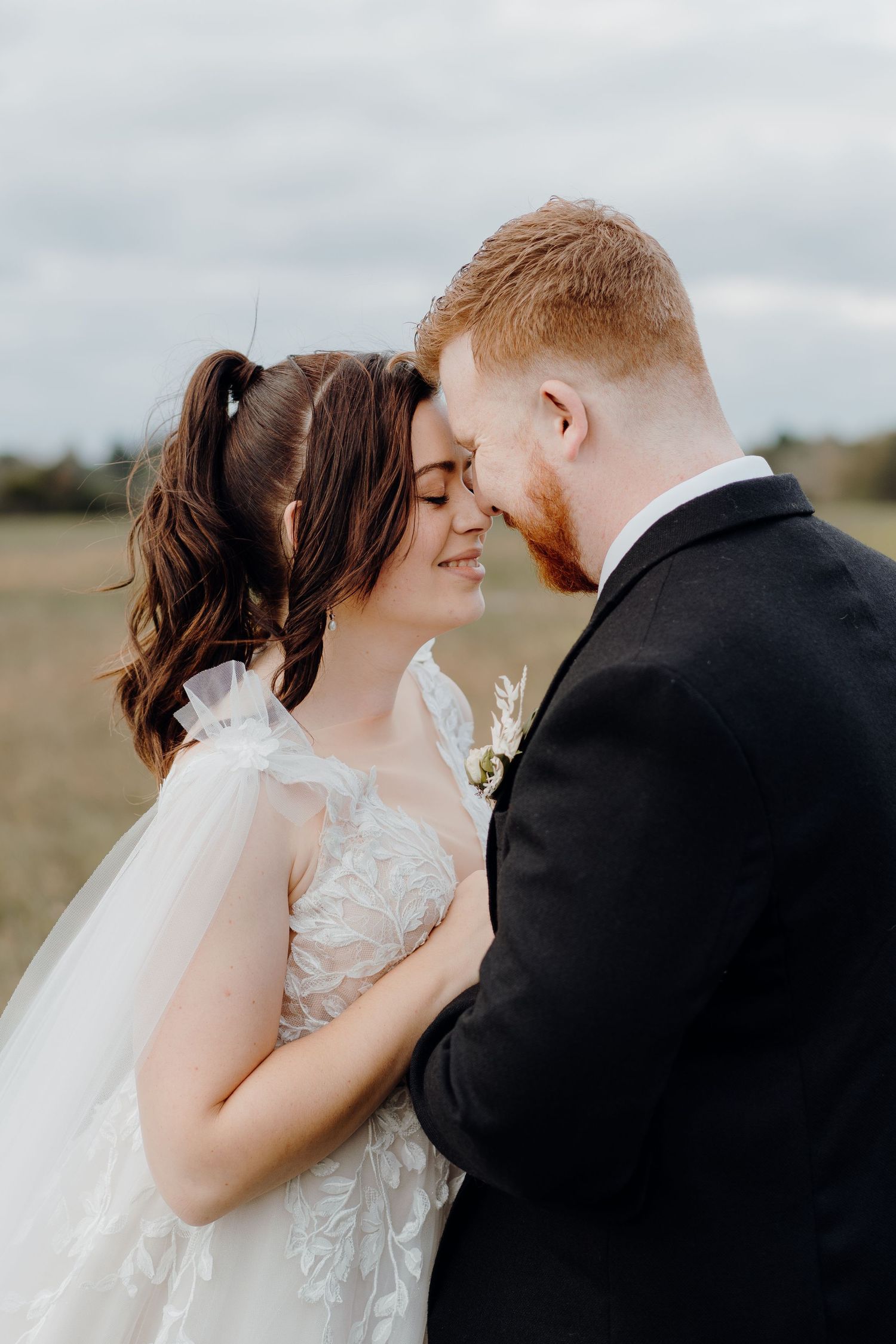 Close up of bride and groom sharing romantic moment