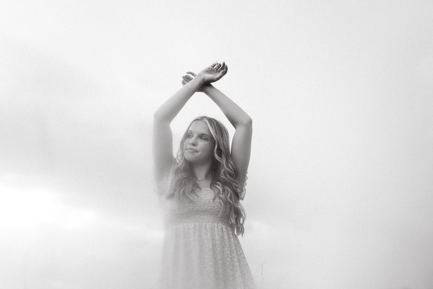 Artistic black and white portrait series with dreamy, ethereal lighting effects.