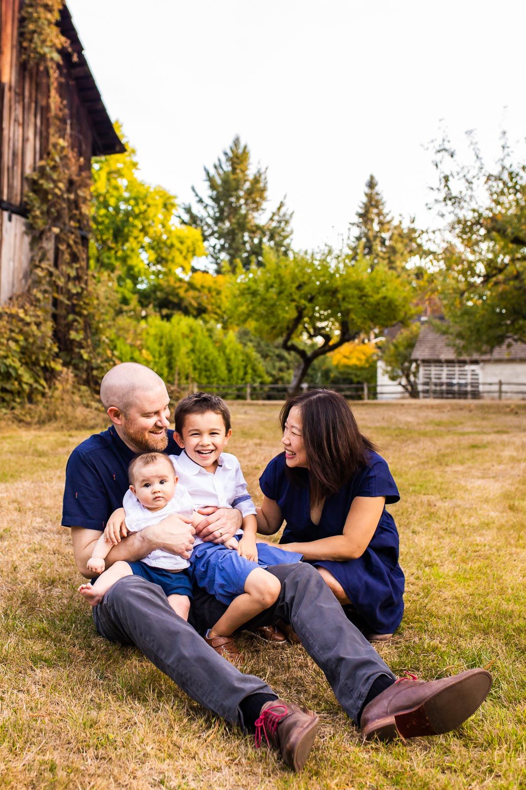 Candid photo of family smiling and laughing at a local park in Kirkland