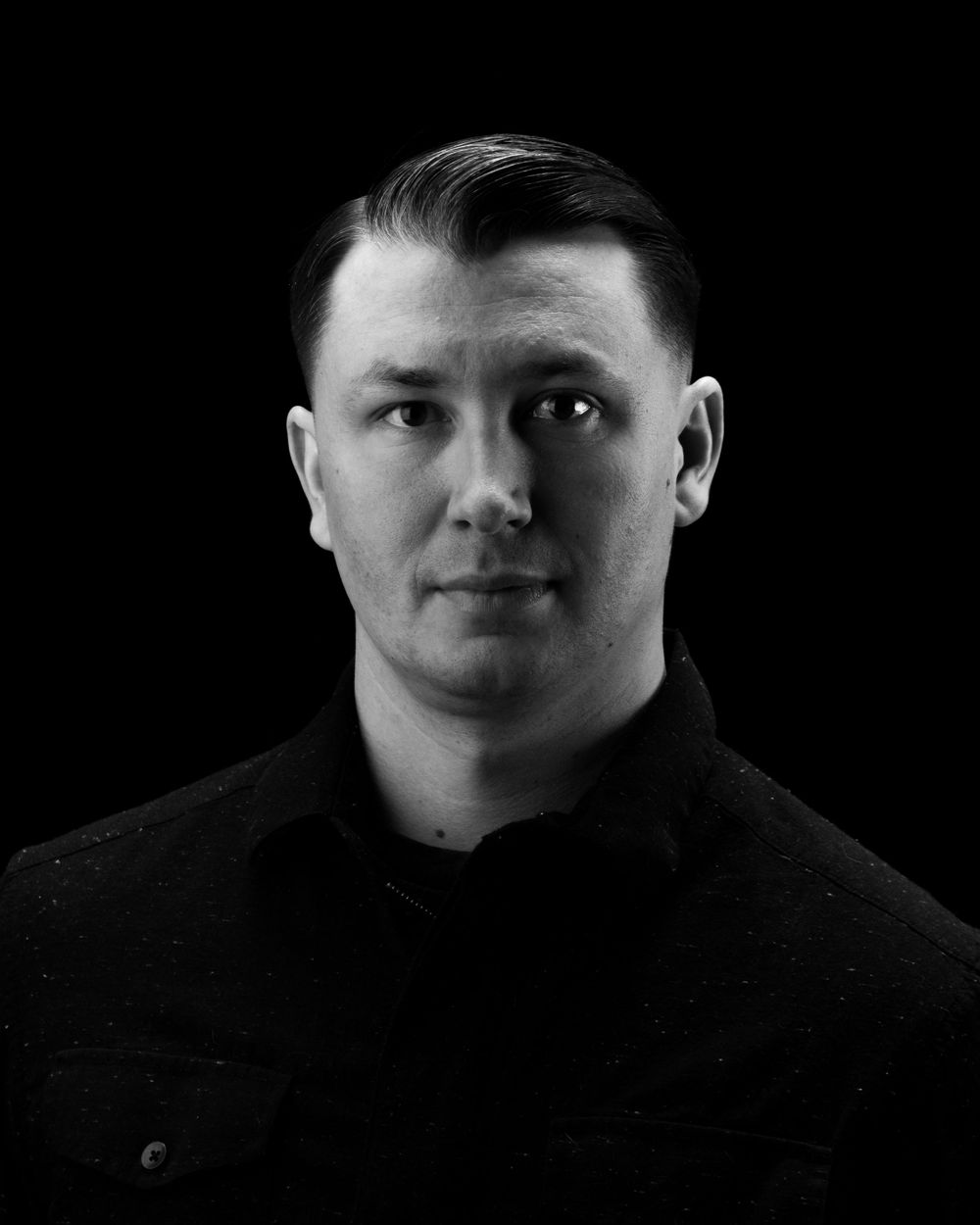 Low-key portrait series against black background showing dramatic side lighting.