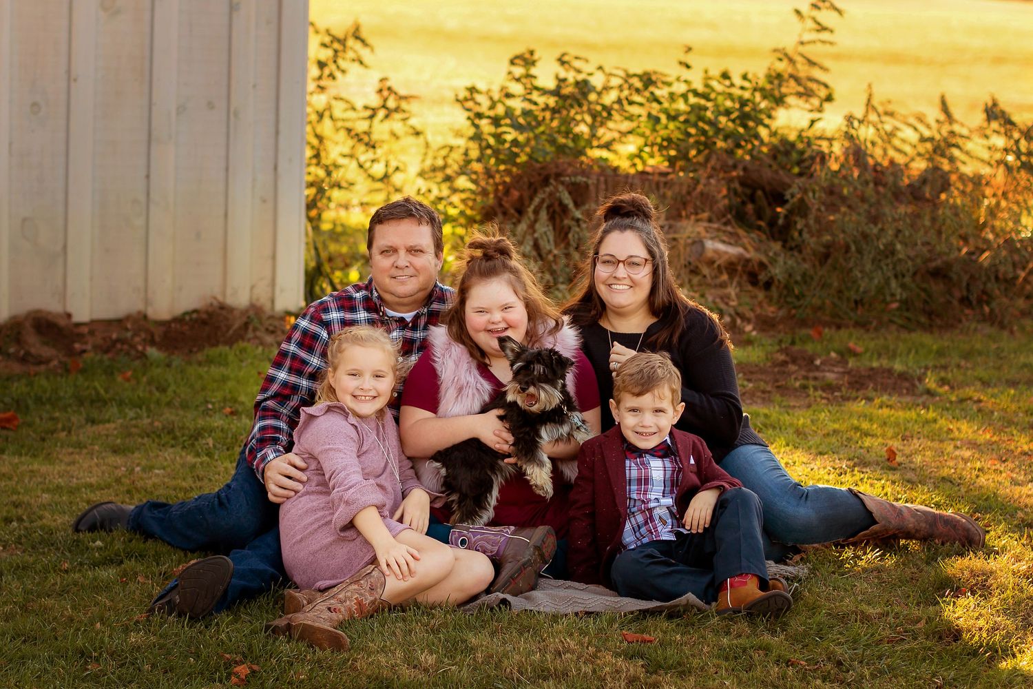 family portrait; mother, father, three children and dog