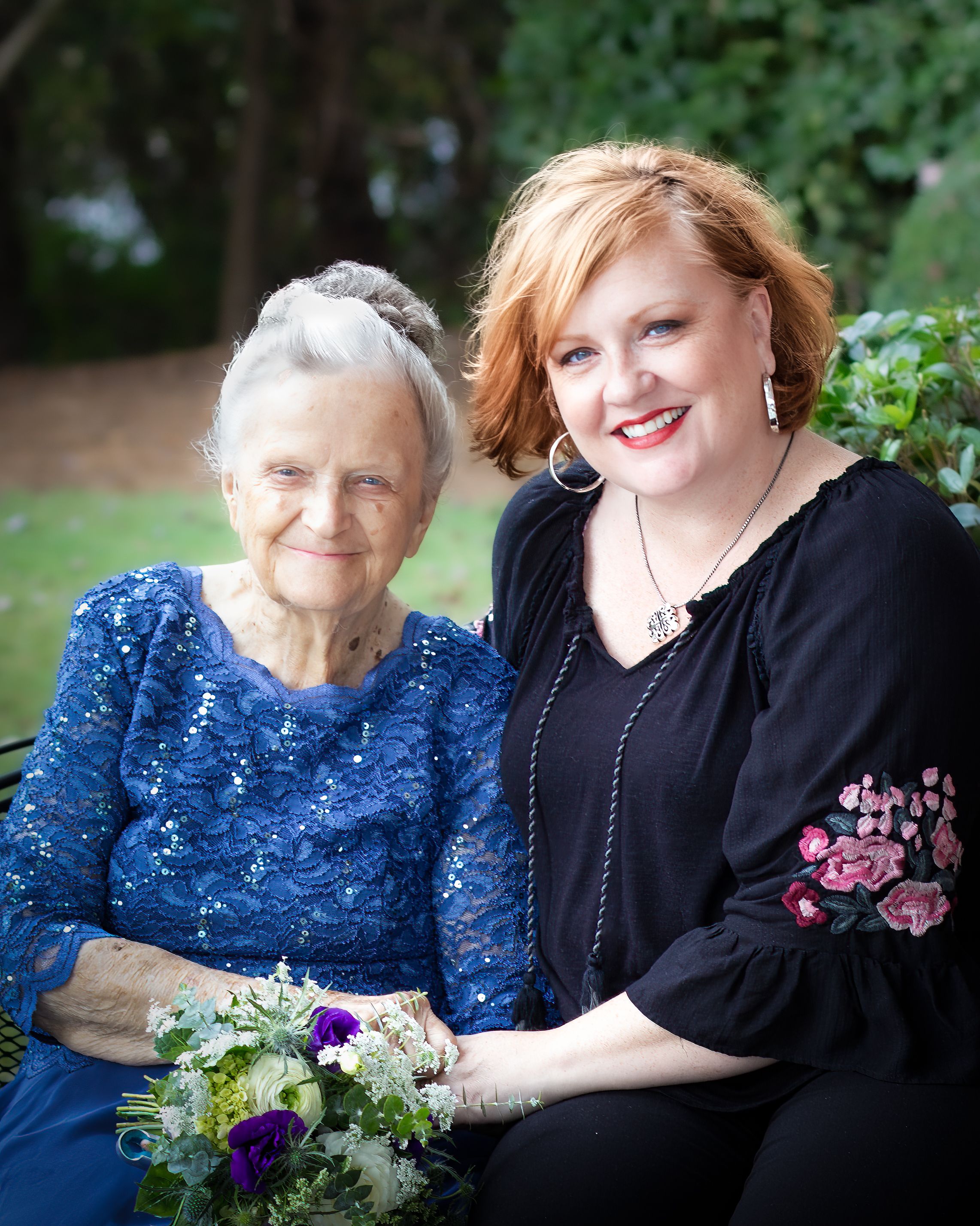 Portrait of Grandmother and Granddaughter with flowers