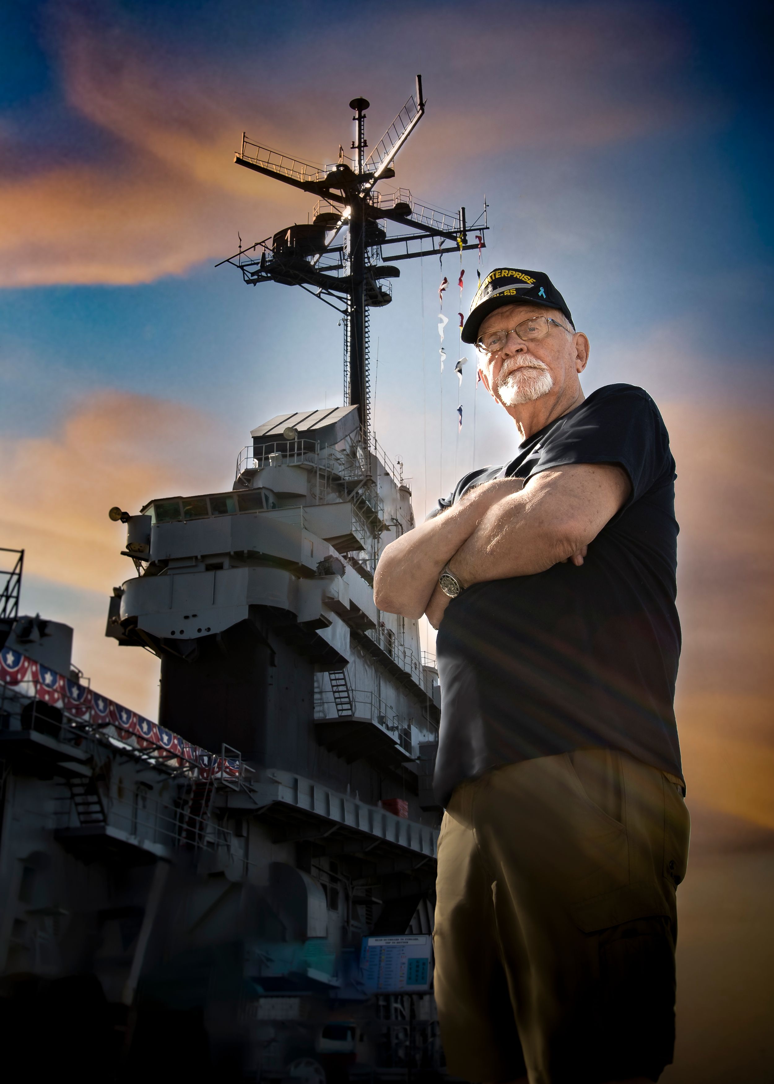 Dramatic Portrait of Old Sailer and Aircraft Carrier