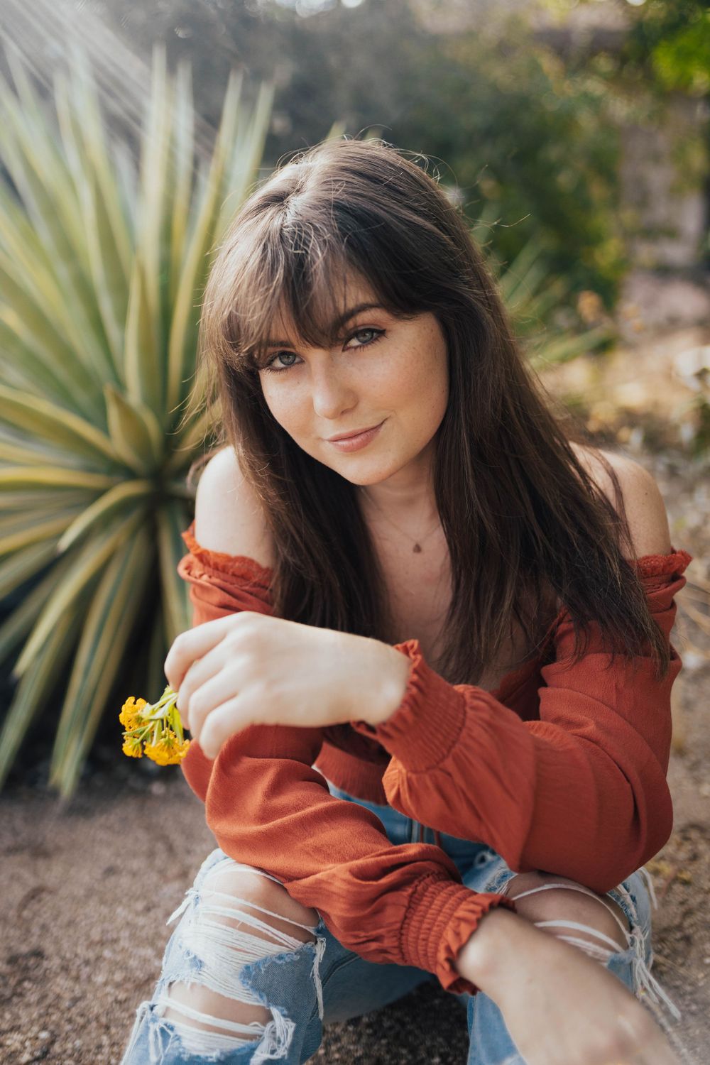 Casual outdoor photography featuring desert landscaping and warm afternoon light.