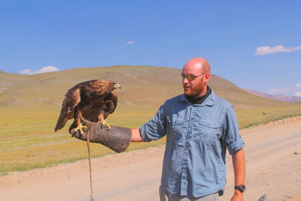 Man holding an eagle