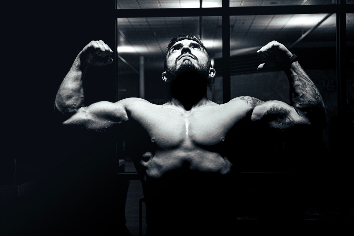 Athlete doing a double biceps pose in a cinematic photo