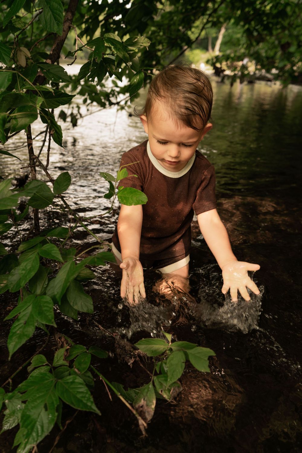 toddler splashes water