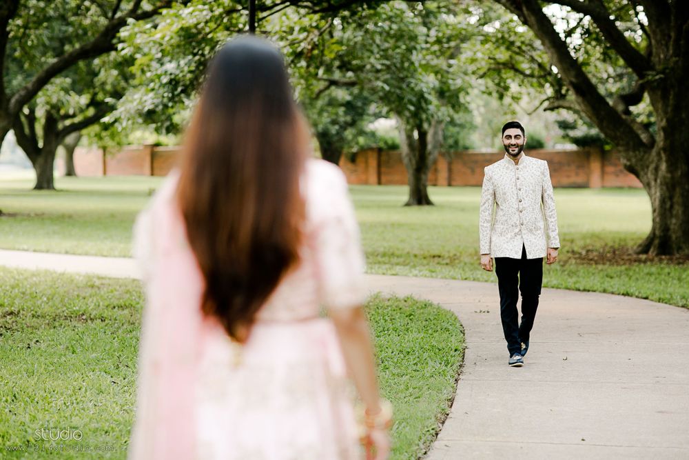 indian groom walking toward bride