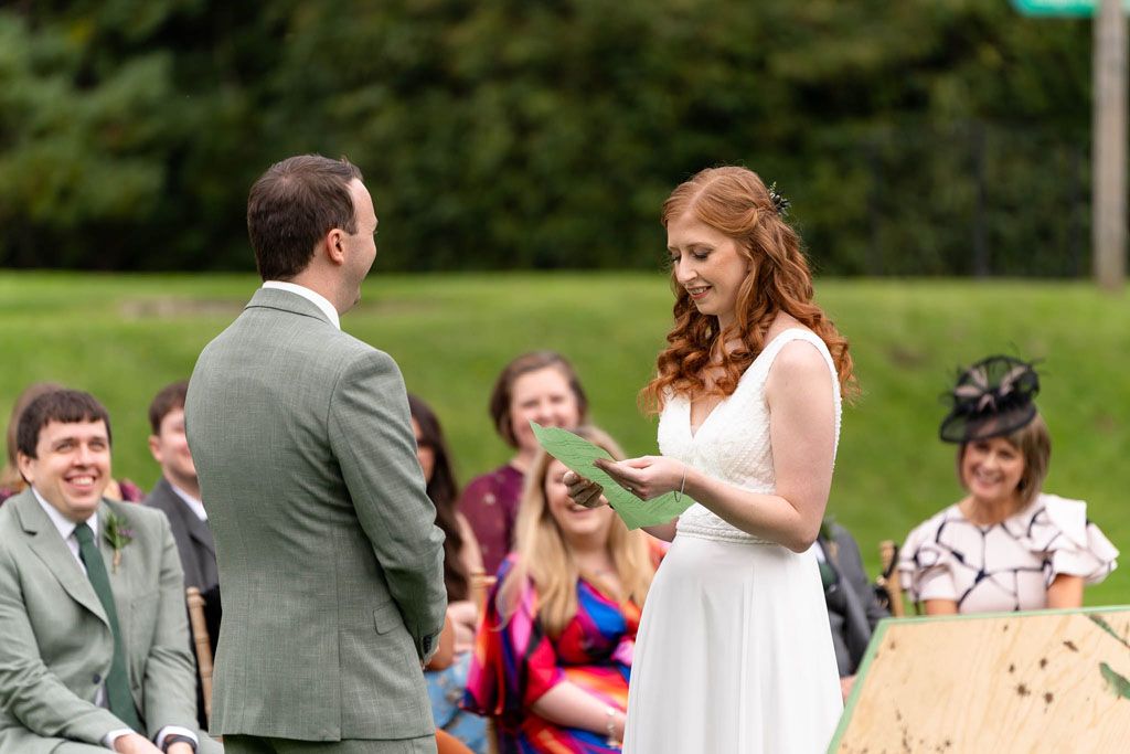 Bride & Groom outside ceremony at Holne Park House Wedding in Devon.