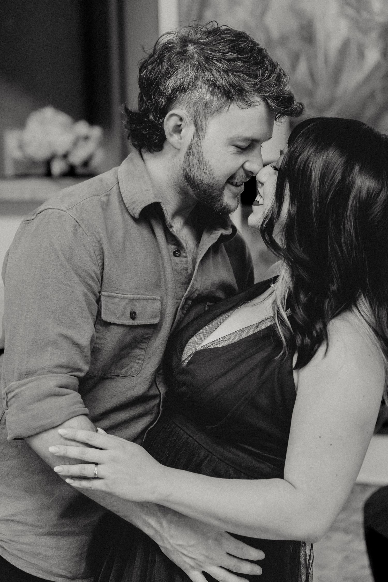 Black and white intimate couple photoshoot showing tender moments.