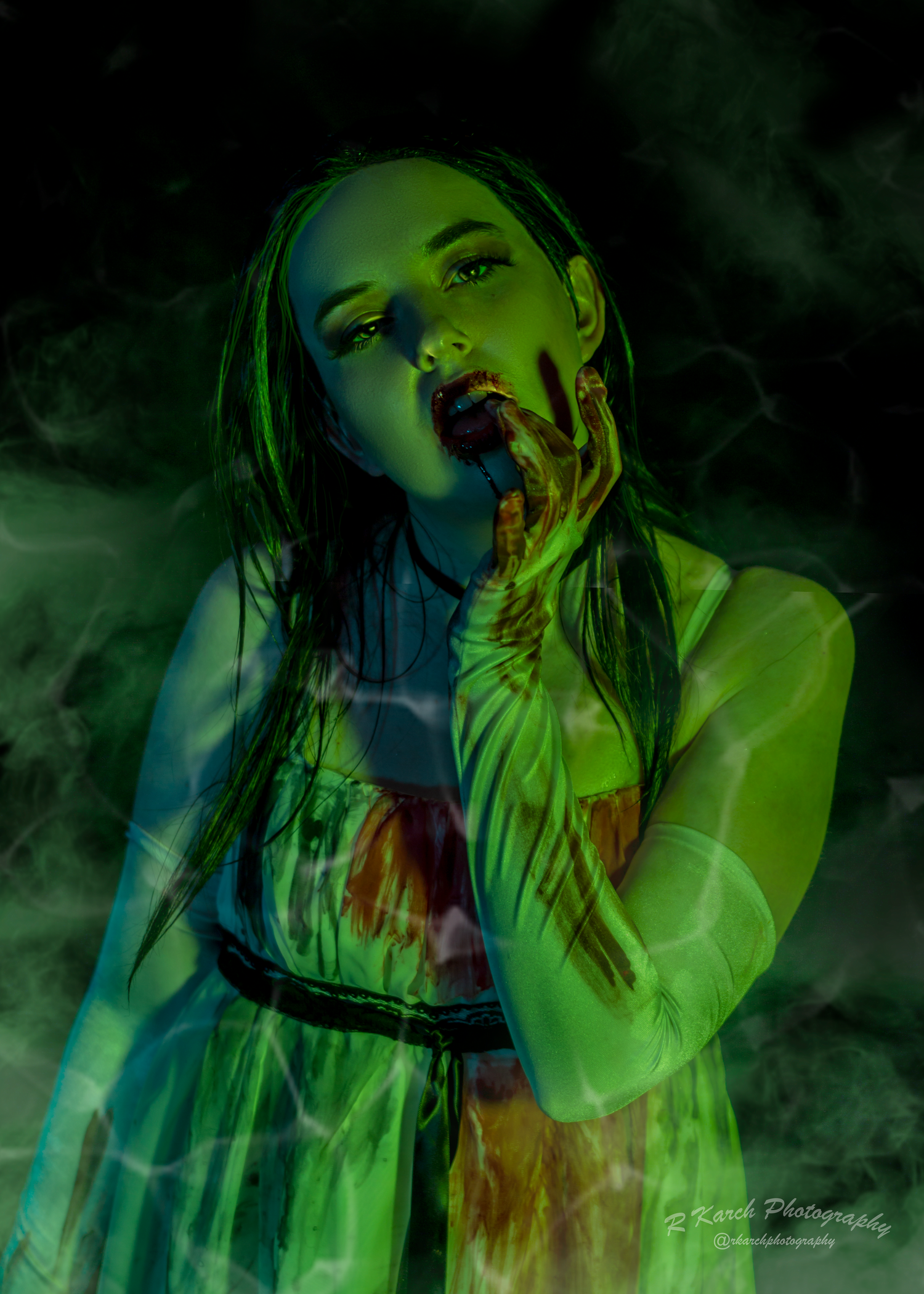 Dark atmospheric portrait bathed in green light with ethereal smoke effects.