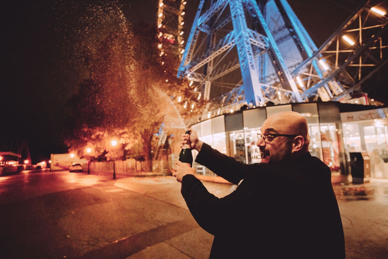 Nighttime sparkler photos showing trails of light against dark industrial structures.