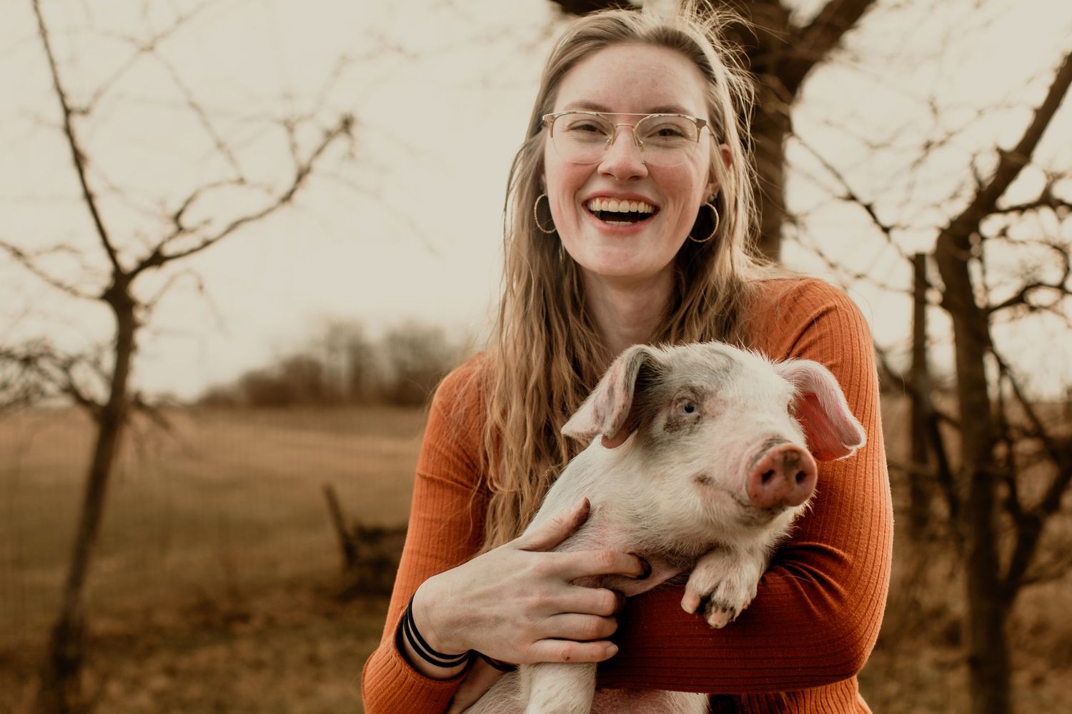 Girl and her pig at golden hour