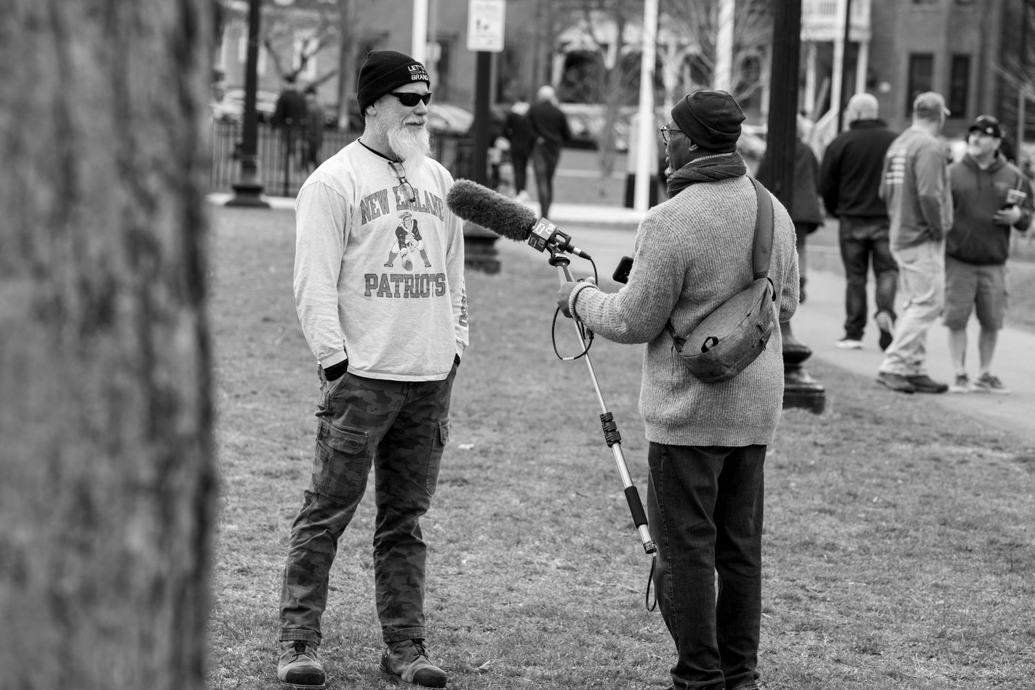 Man wearing "Let' Go Brandon" hat is interviewed by WGBH reporter Phillip W.d Martin. Photo by Lita Xú Líng Kelley