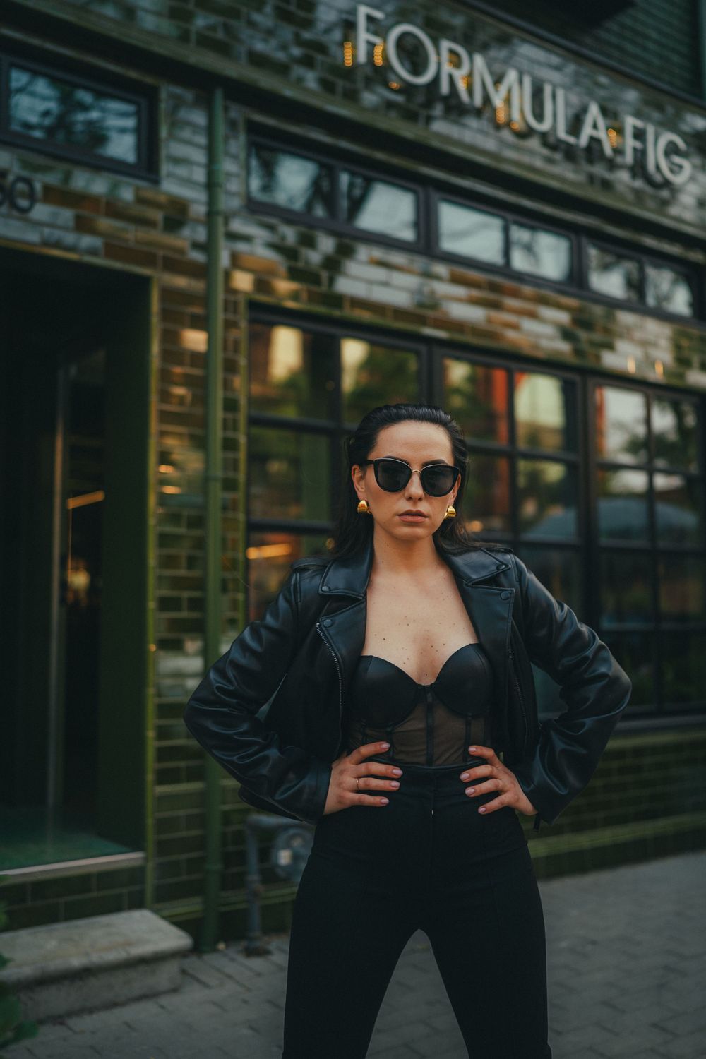 Street style portrait outside Formula Fig storefront with modern urban ambiance.