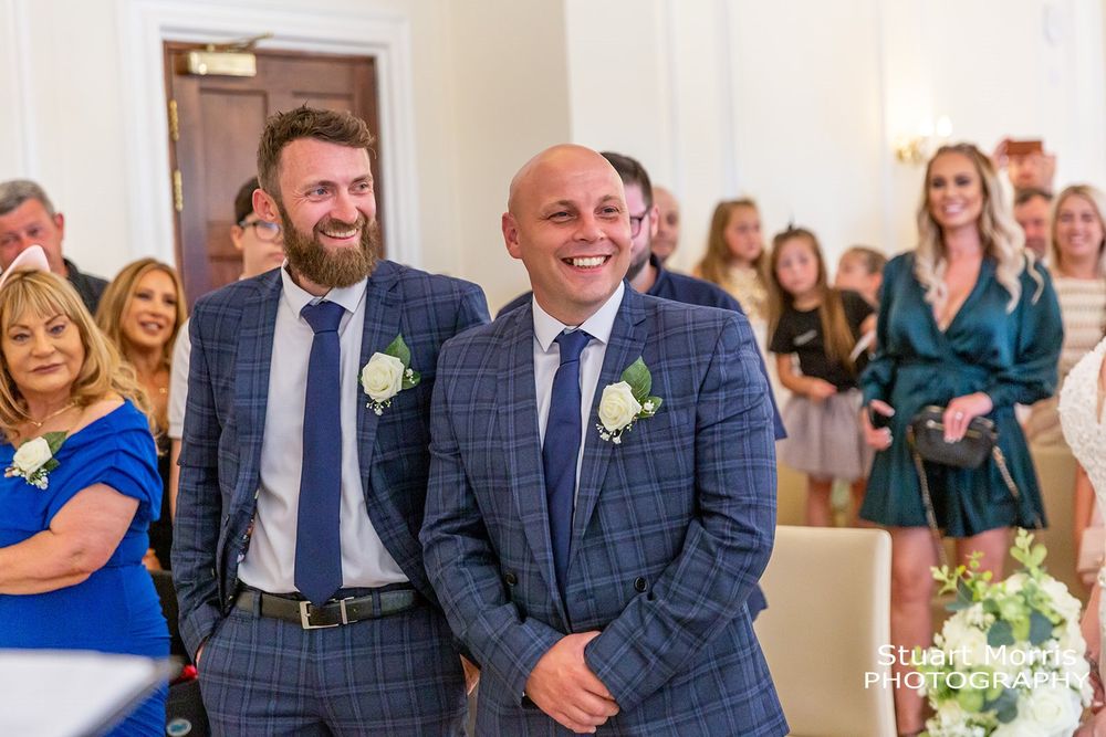 Groom and best man smiling before the ceremony at west tower. Lancashire Wedding photographer. Country house wedding