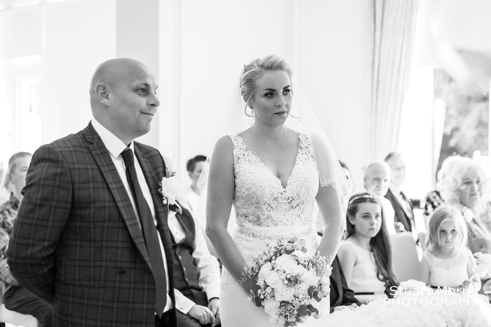 Bride and goom smiling during the West tower wedding. Lancashire wedding photographer. Country house wedding photography
