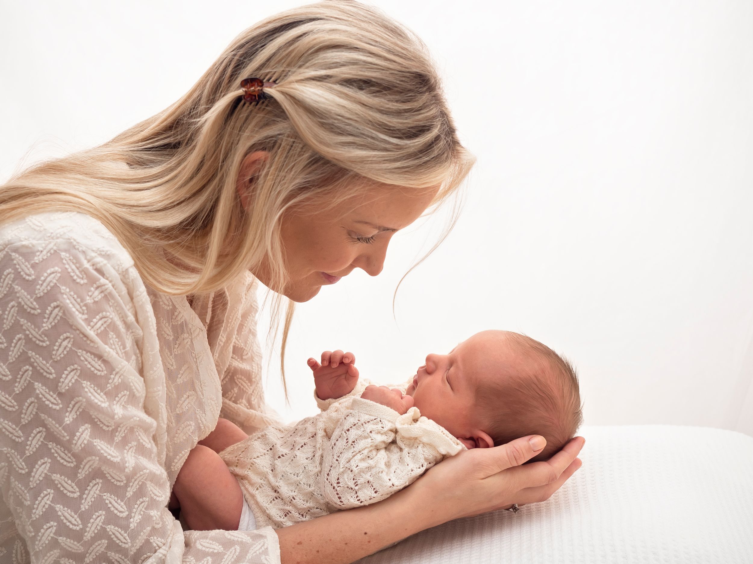A professional portrait of a mother with her newborn taken by Didcot studio Verity Photography