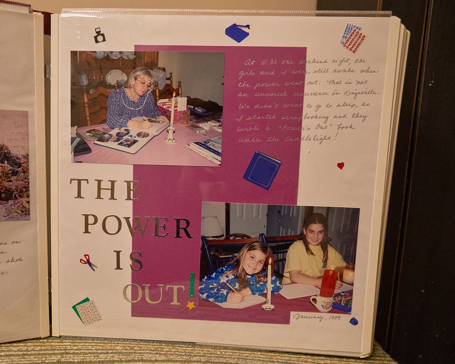 Mother and daughters scrapbooking by candlelight