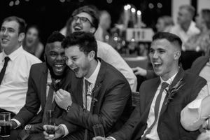 Celebrations.Groomsmen enjoying the grooms speech at The Nut Farm Venue.