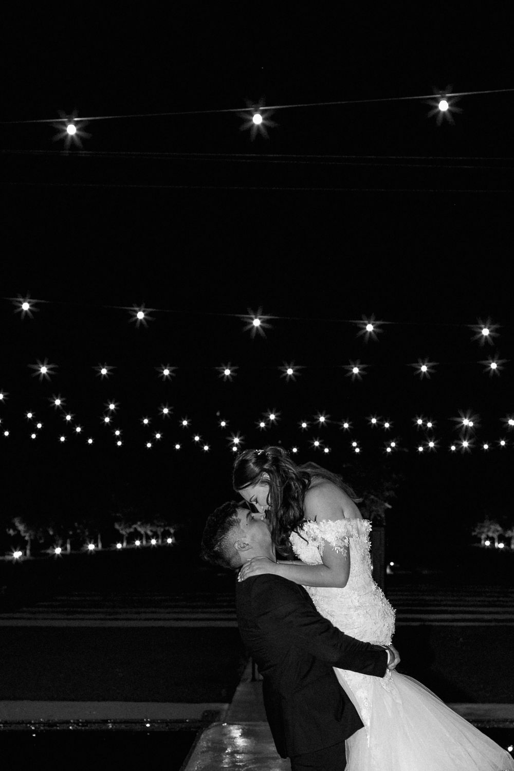Starlit portrait of a bride and groom at thier wedding reception.