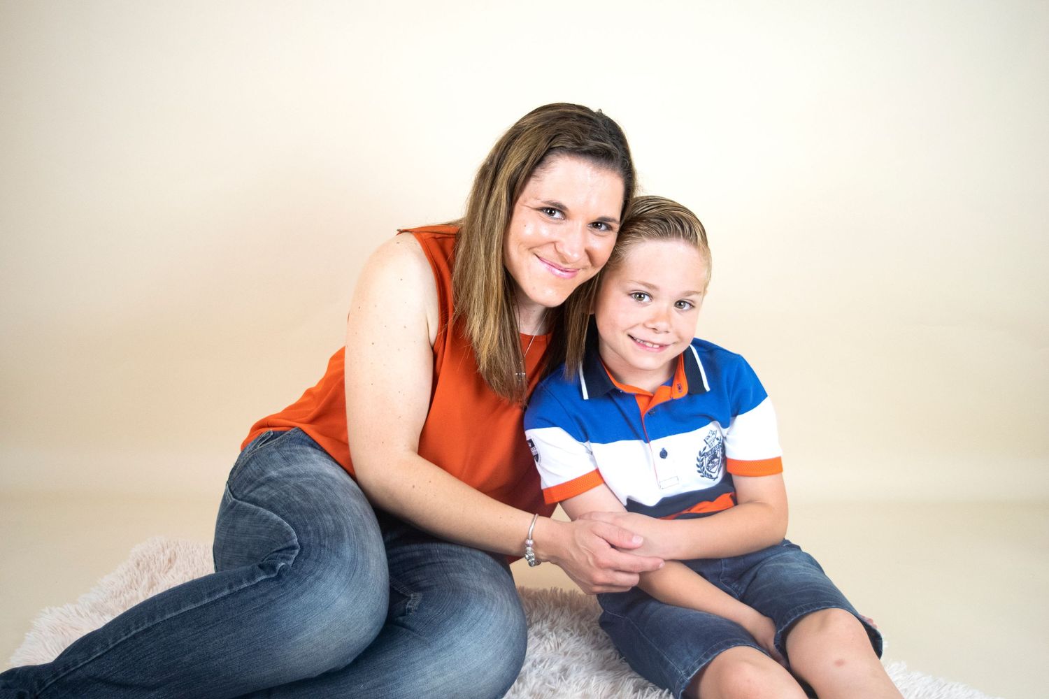 mother and son portrait posed hug smiling during family session taken by heather katie photography.
