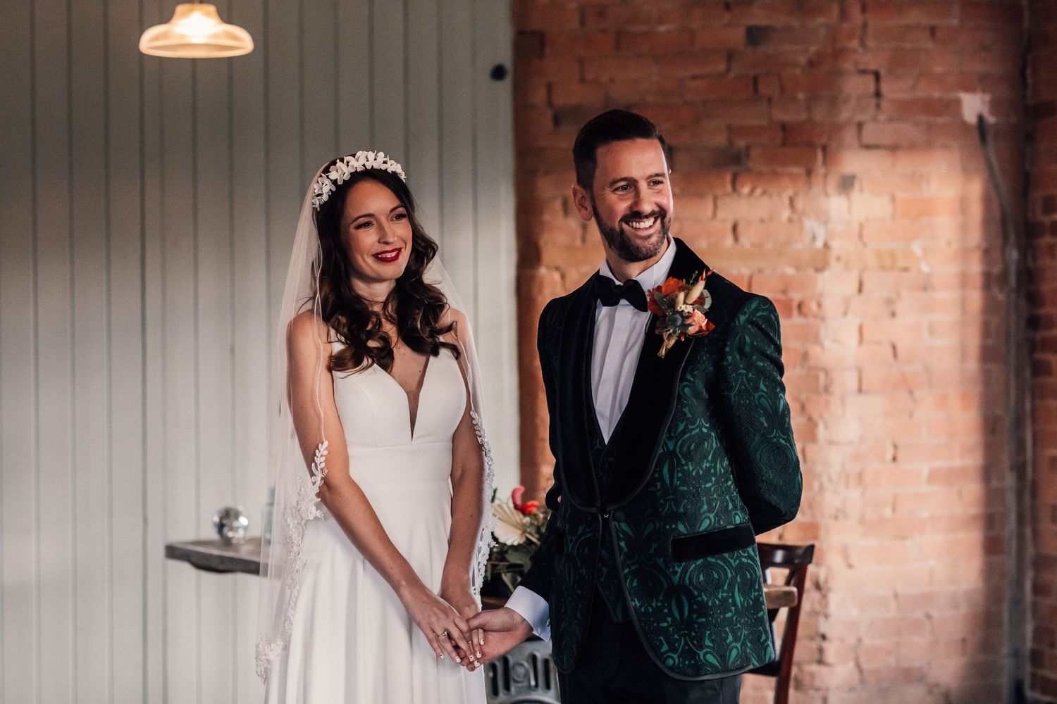 bride and groom holding hands