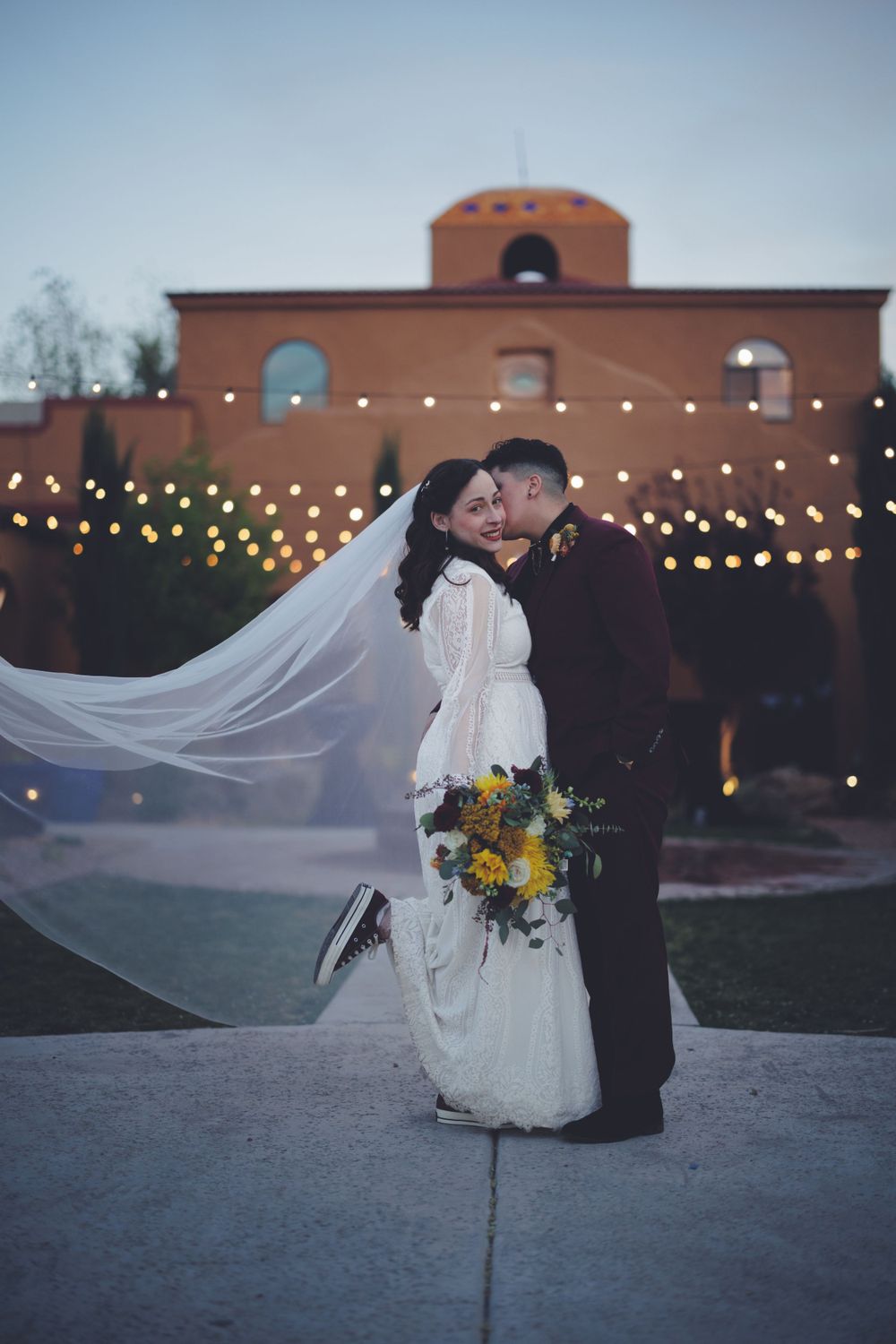 LGBTQ couple posing for their wedding photos at Blue Door Venue