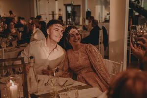 Guests enjoying an intimate moment at a candlelit wedding reception.